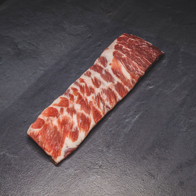 Pork Ribs taglio "St.Louis" Pork Ribs taglio St Louis su sfondo scuro